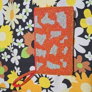 YOA beaded clutch in iridescent orange